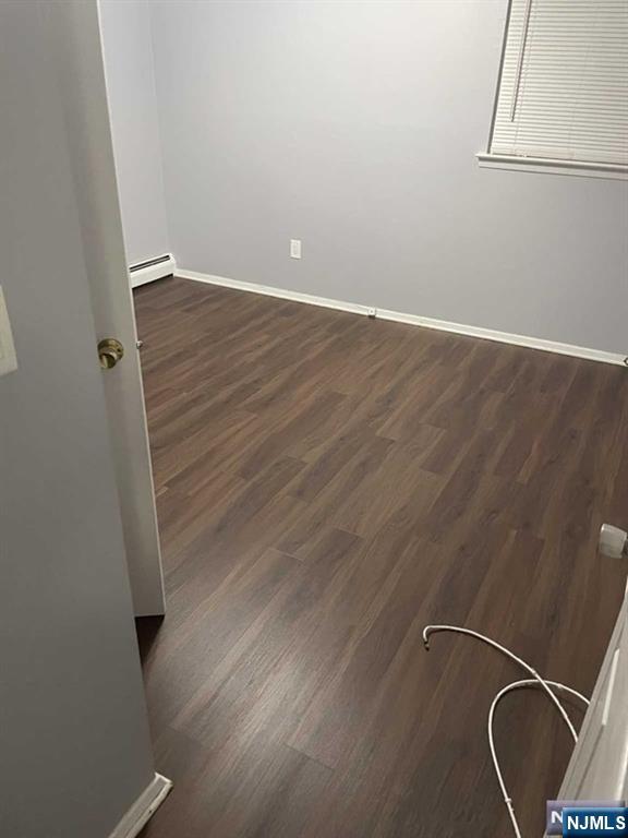 60 Maiden Lane, Unit 2 Little Ferry, NJ 07643 - Photo 12 of 22 an empty room with wooden floor and windows