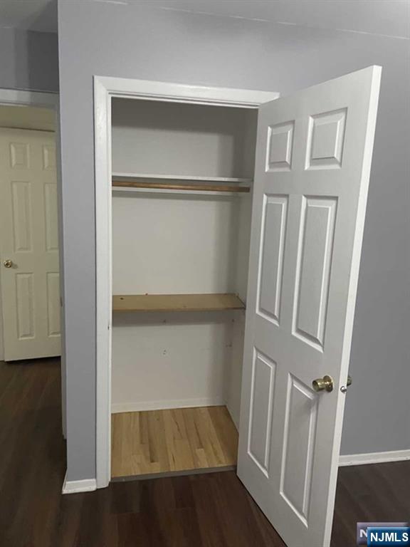60 Maiden Lane, Unit 2 Little Ferry, NJ 07643 - Photo 13 of 22 a view of walk in closet with empty racks