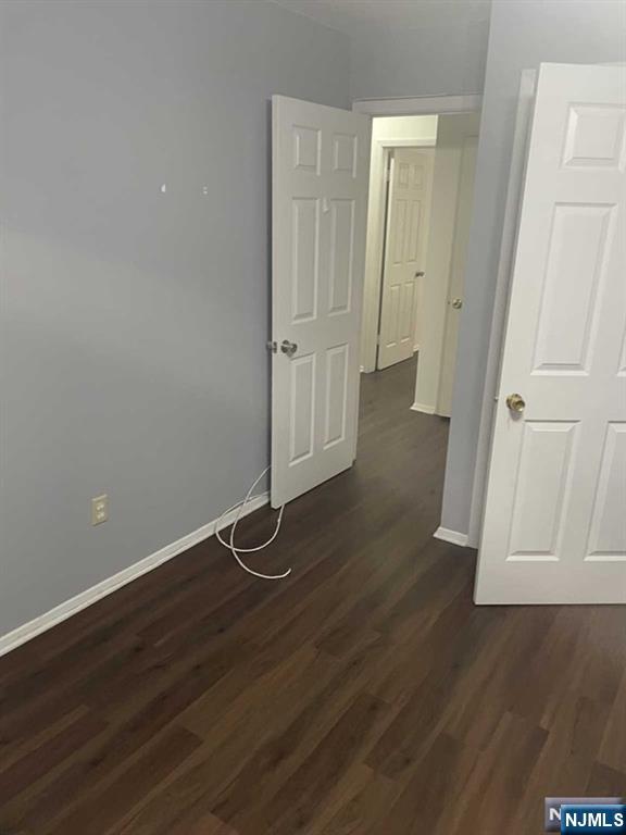 60 Maiden Lane, Unit 2 Little Ferry, NJ 07643 - Photo 16 of 22 an empty room with wooden floor and entrance