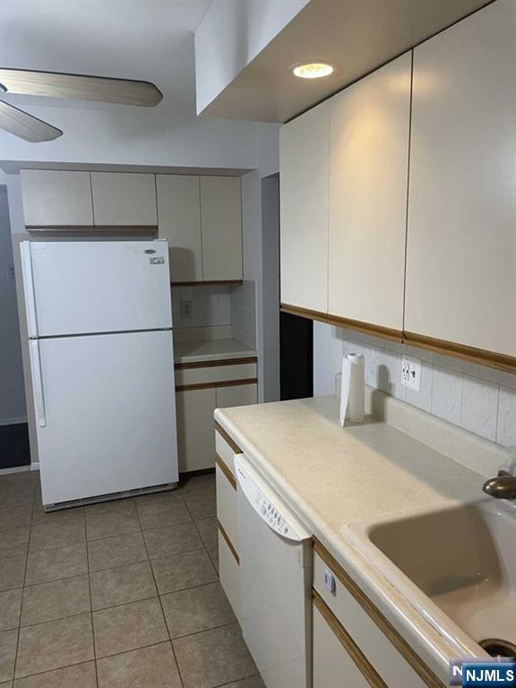 60 Maiden Lane, Unit 2 Little Ferry, NJ 07643 - Photo 6 of 22 a kitchen with a refrigerator and a sink
