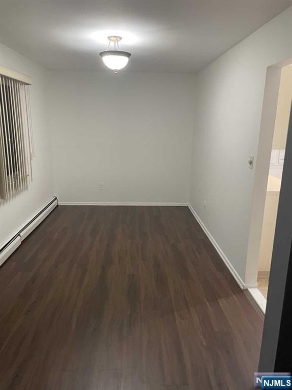 60 Maiden Lane, Unit 2 Little Ferry, NJ 07643 - Photo 7 of 22 an empty room with wooden floor and windows