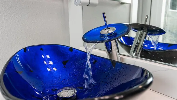a view of a room with furniture and chandelier