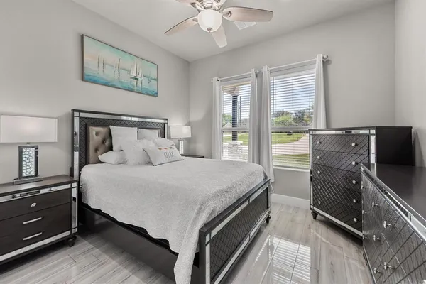 a bed room with a bed and a night stand