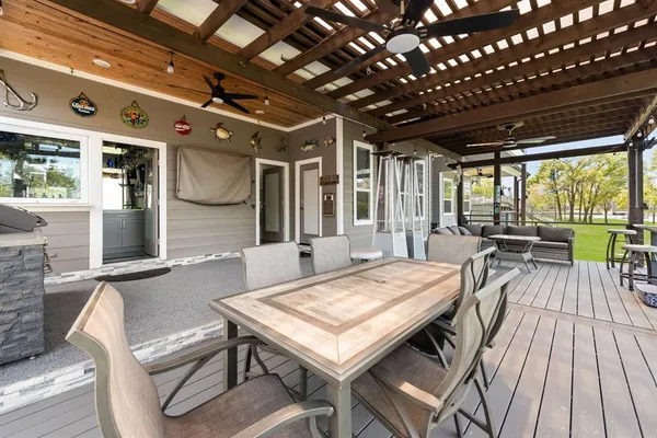 a view of a patio with a table and chairs