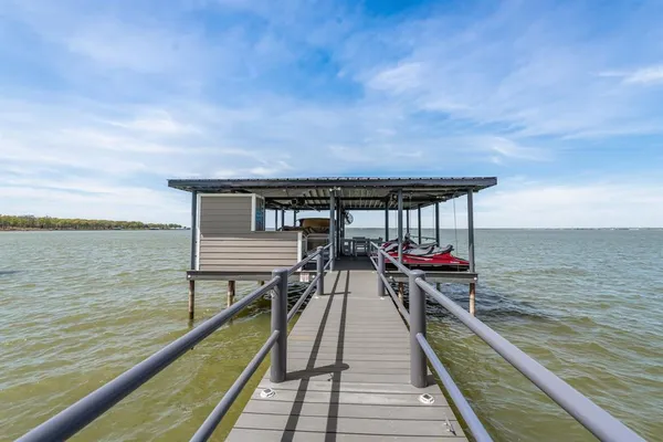 a view of a balcony with chairs