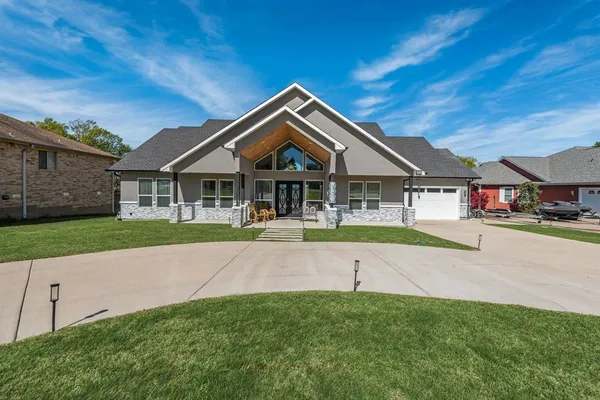 a house with tall trees in the background
