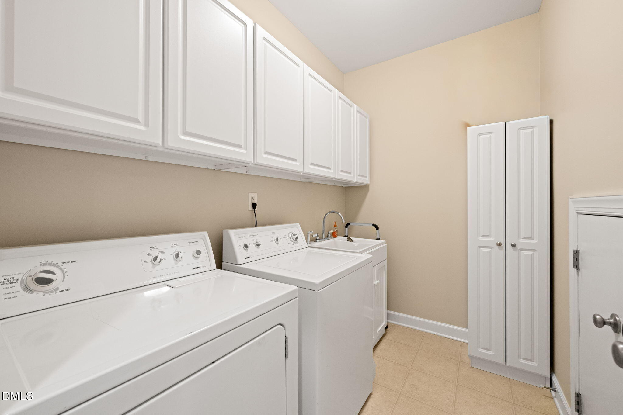 1009 Hidden River Court Raleigh, NC 27614 - Photo 27 of 55 5.7 x 8ft - main floor laundry with built-in cabinets.