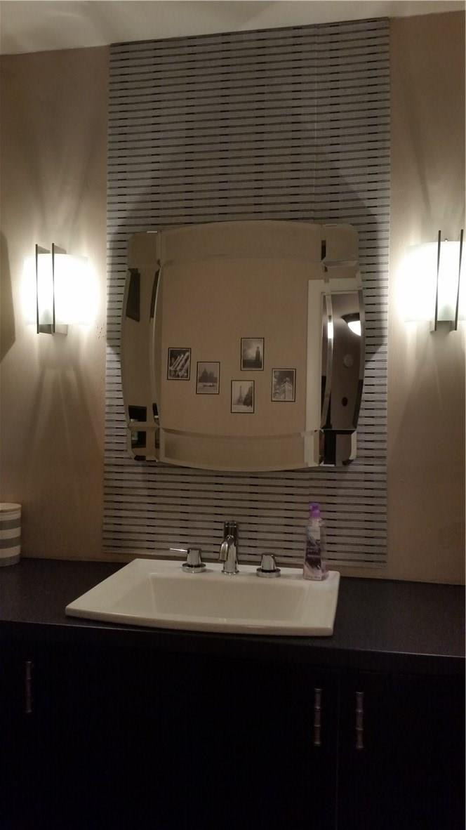9711 North New River Canal Road, Unit 212 Plantation, FL 33324 - Photo 14 of 41 a bathroom with a sink and a mirror