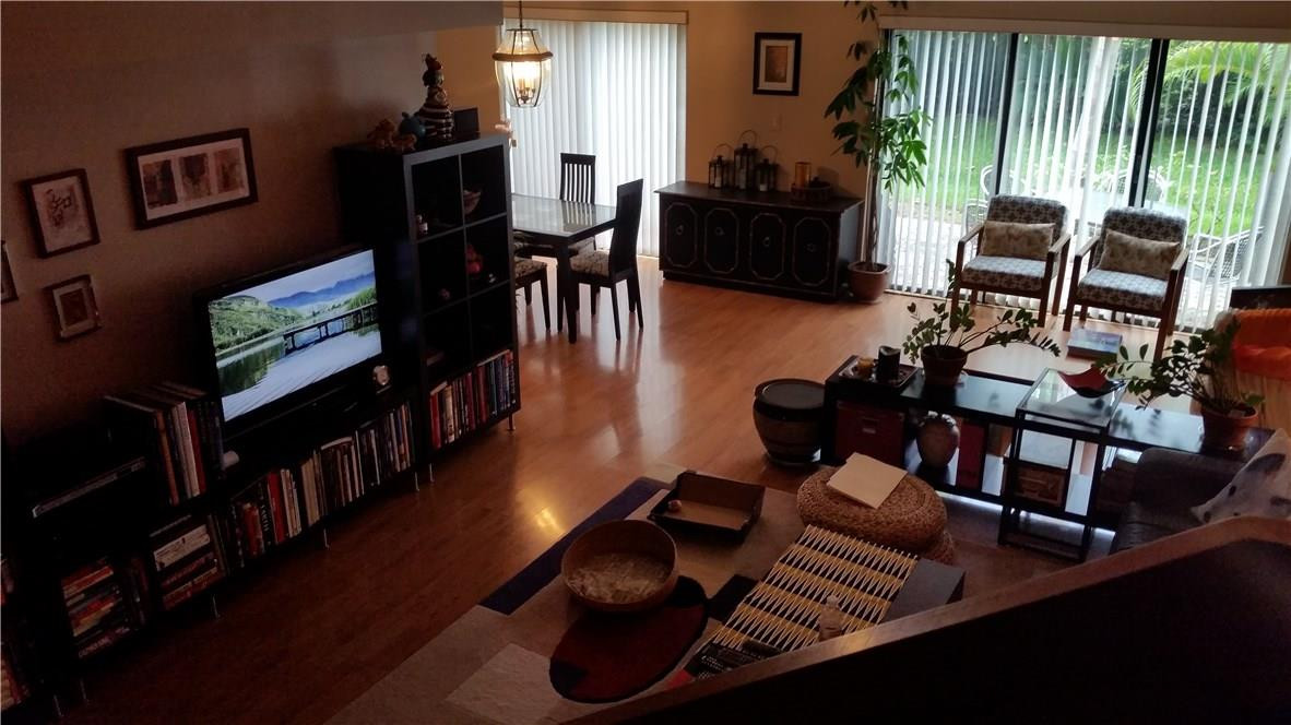 9711 North New River Canal Road, Unit 212 Plantation, FL 33324 - Photo 18 of 41 a living room with furniture and a flat screen tv