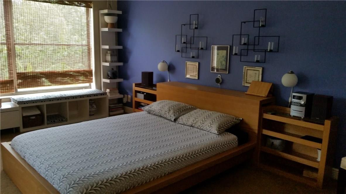 9711 North New River Canal Road, Unit 212 Plantation, FL 33324 - Photo 19 of 41 a bedroom with a large bed and a window