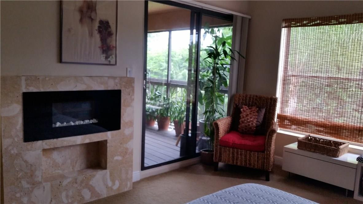 9711 North New River Canal Road, Unit 212 Plantation, FL 33324 - Photo 21 of 41 a living room with furniture and a fireplace