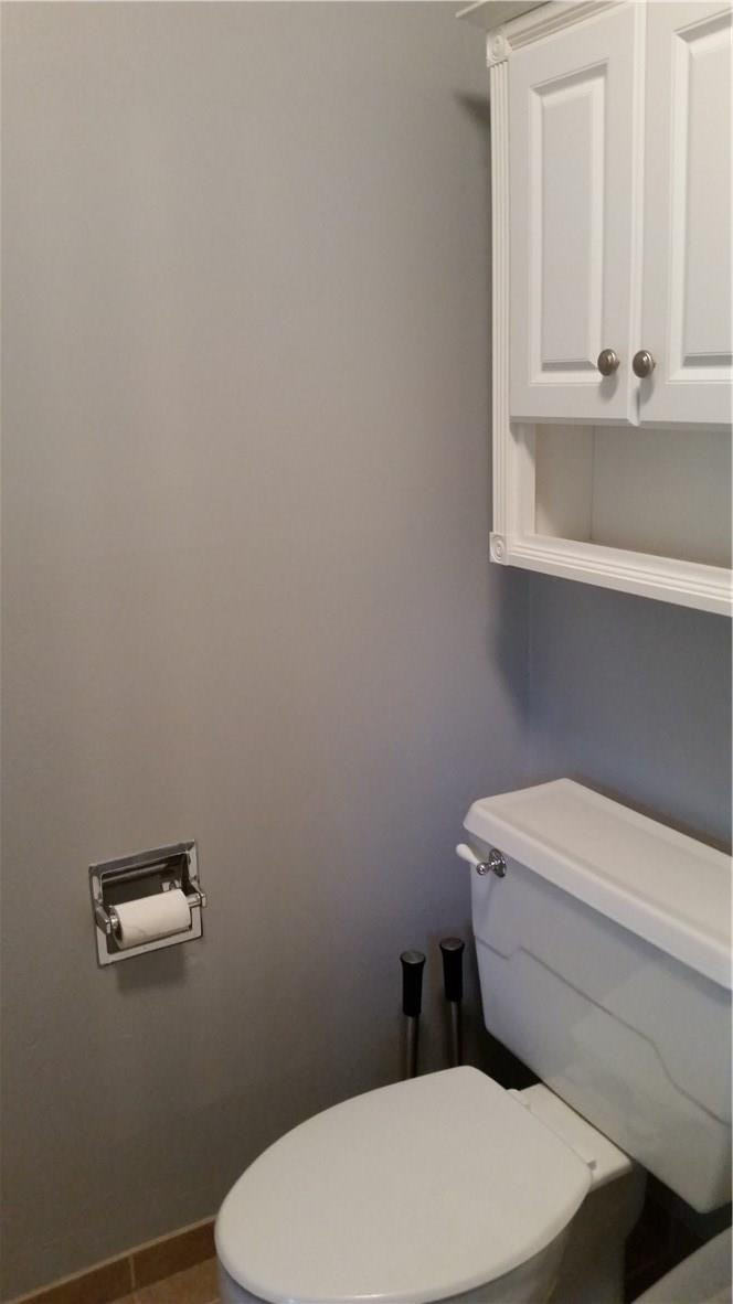 9711 North New River Canal Road, Unit 212 Plantation, FL 33324 - Photo 27 of 41 a white toilet sitting next to a bathroom sink