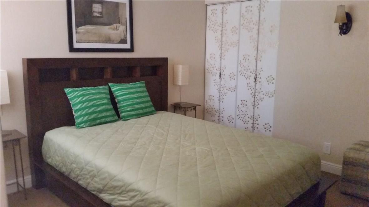 9711 North New River Canal Road, Unit 212 Plantation, FL 33324 - Photo 30 of 41 a bedroom with a bed and a window