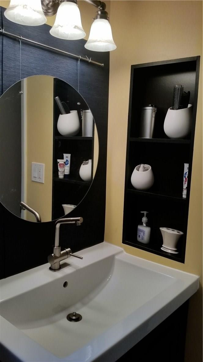 9711 North New River Canal Road, Unit 212 Plantation, FL 33324 - Photo 31 of 41 a bathroom with a sink and a mirror