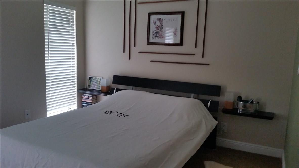 9711 North New River Canal Road, Unit 212 Plantation, FL 33324 - Photo 33 of 41 a bedroom with a bed and a window