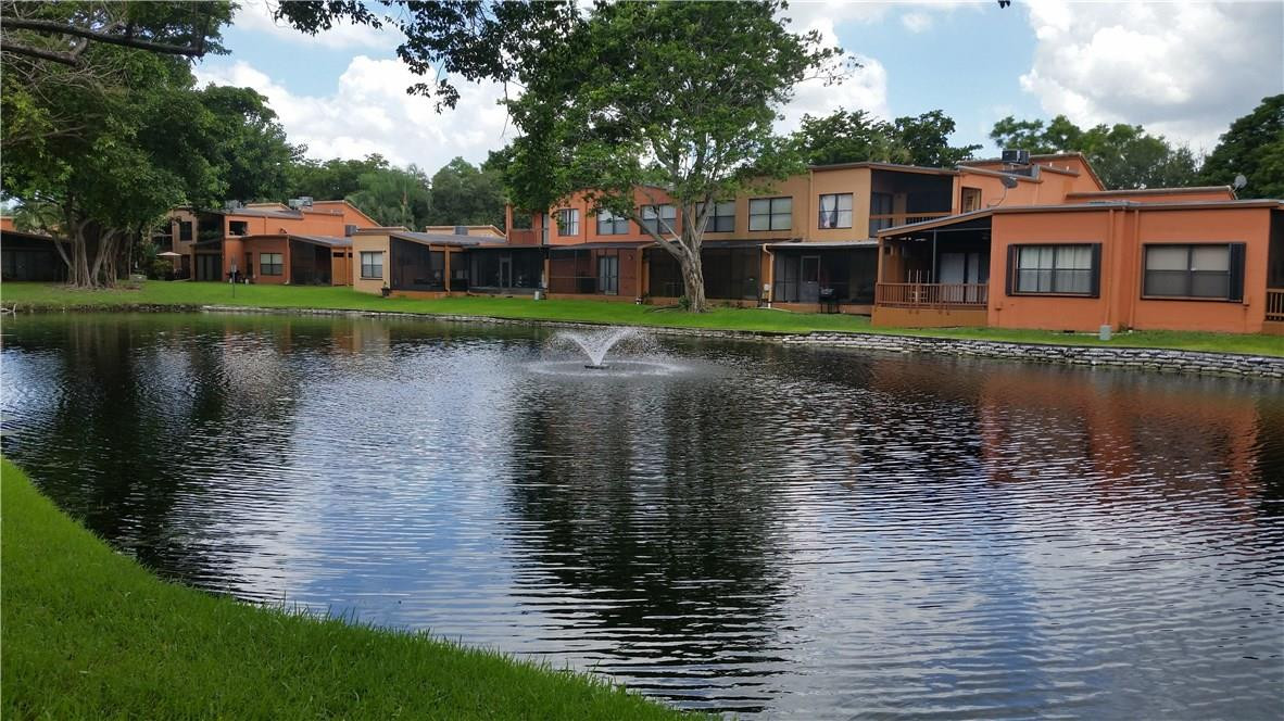 9711 North New River Canal Road, Unit 212 Plantation, FL 33324 - Photo 38 of 41 a front view of a house with a lake view