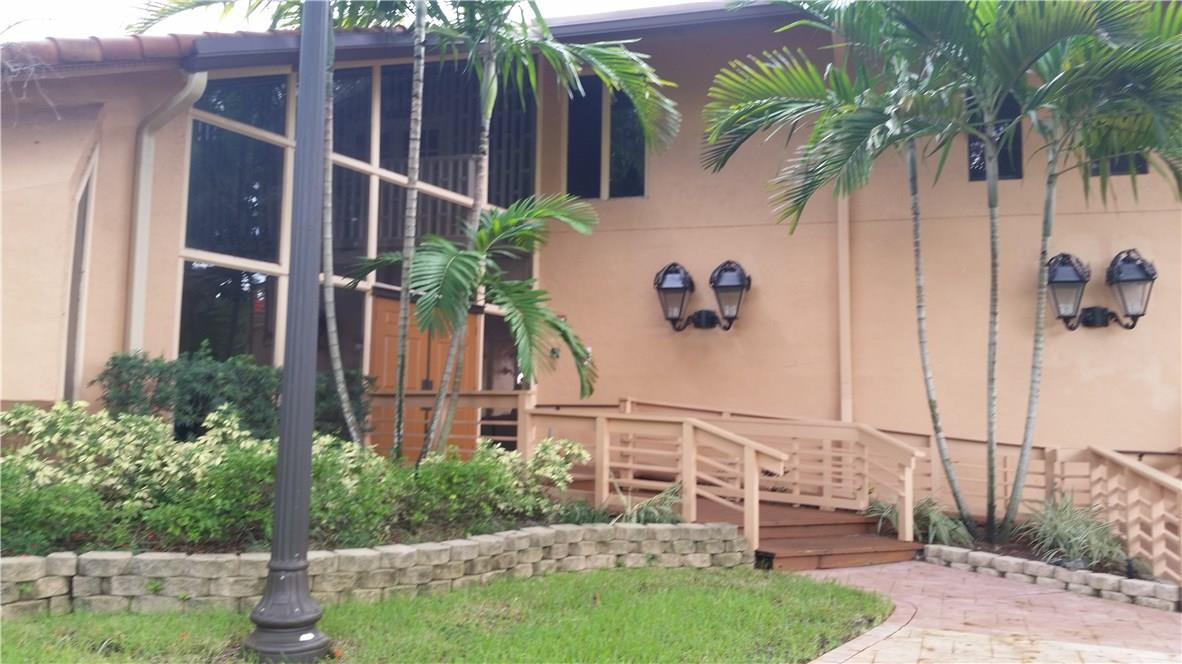 9711 North New River Canal Road, Unit 212 Plantation, FL 33324 - Photo 39 of 41 a view of a backyard with potted plants
