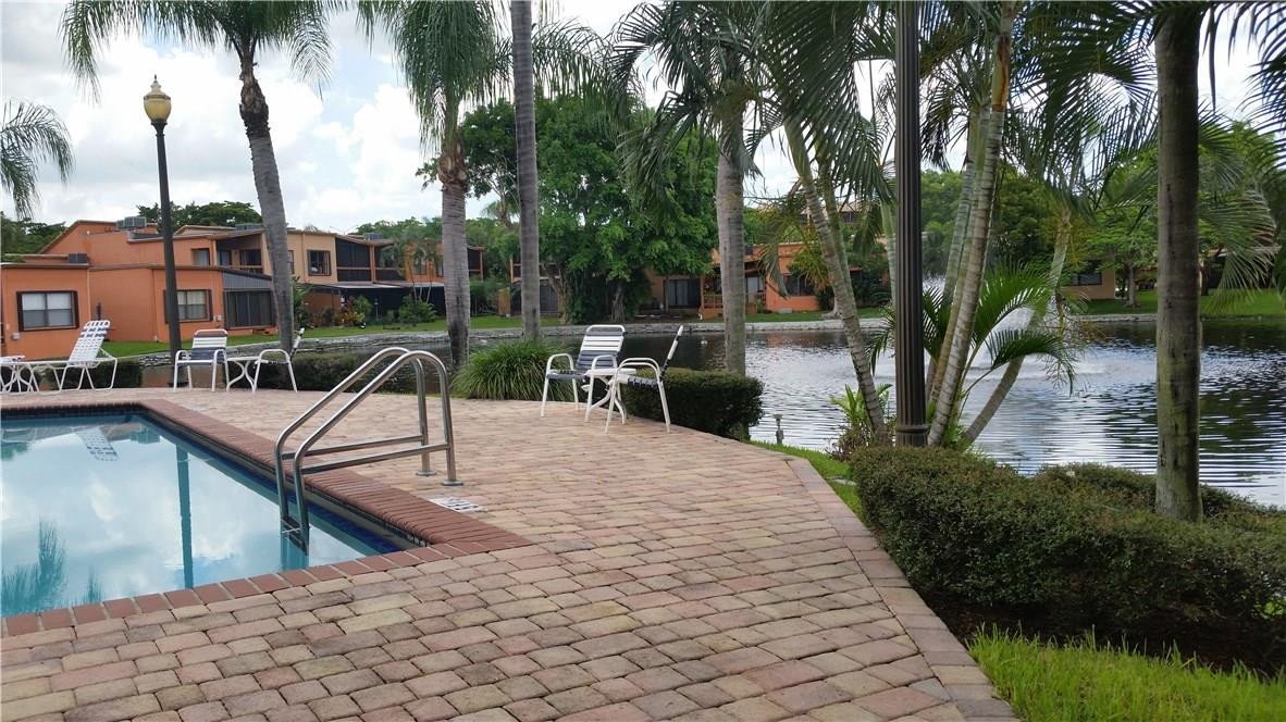 9711 North New River Canal Road, Unit 212 Plantation, FL 33324 - Photo 41 of 41 a view of a backyard with sitting area