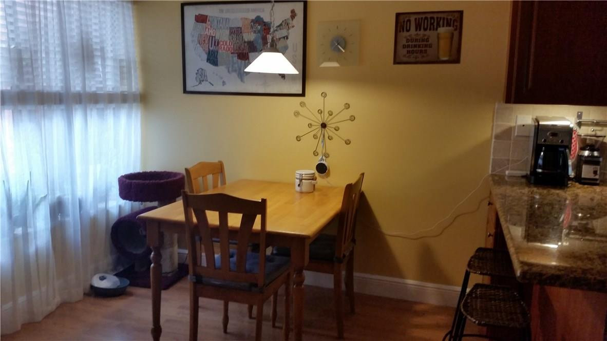 9711 North New River Canal Road, Unit 212 Plantation, FL 33324 - Photo 5 of 41 a view of a dining room with furniture and wooden floor