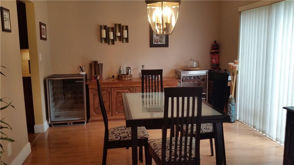 9711 North New River Canal Road, Unit 212 Plantation, FL 33324 - Photo 9 of 41 a view of a dining room with furniture and wooden floor
