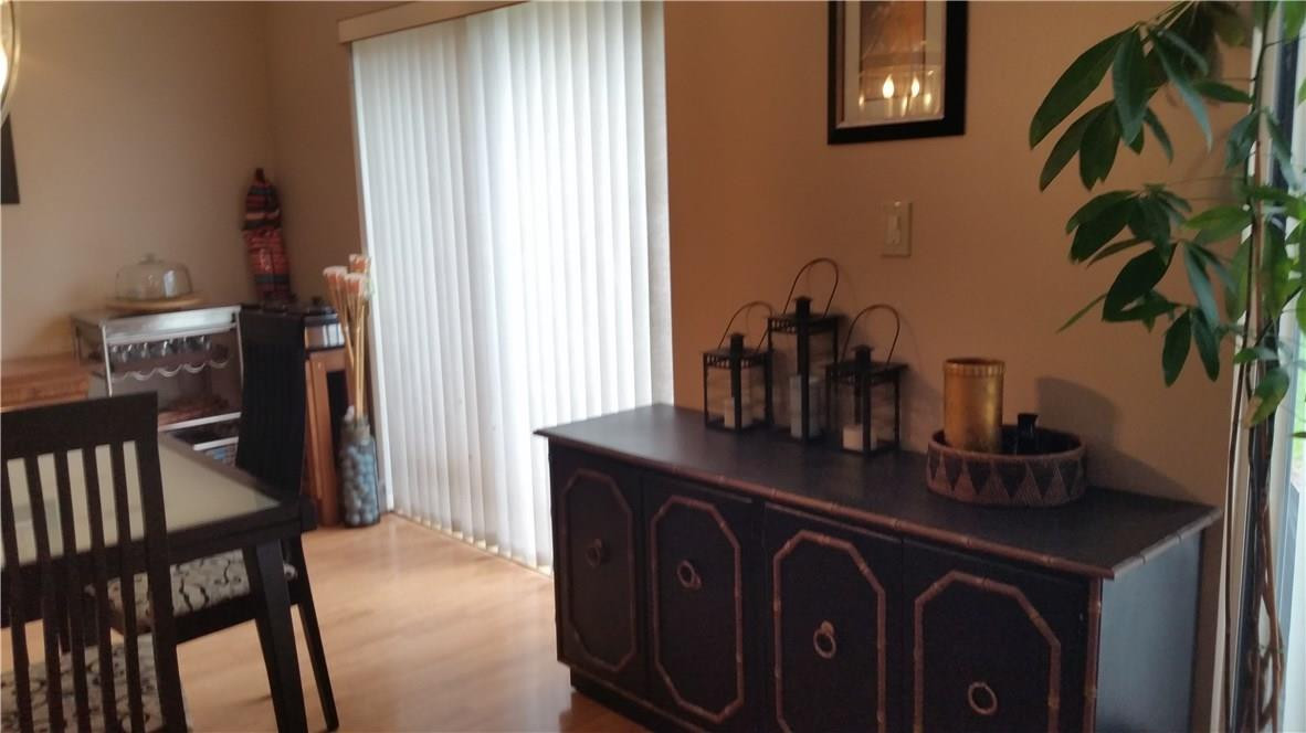 9711 North New River Canal Road, Unit 212 Plantation, FL 33324 - Photo 10 of 41 a kitchen with a table and cabinets