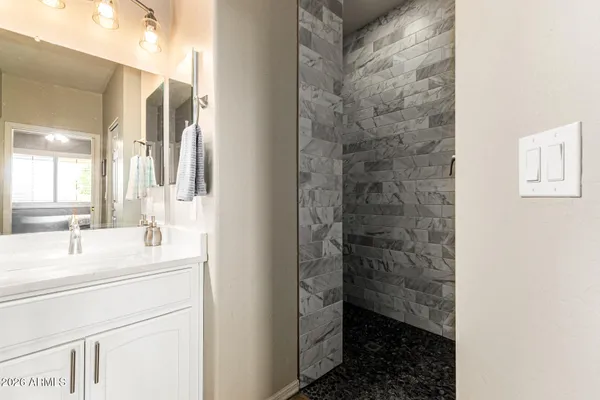 a bathroom with a sink and a mirror