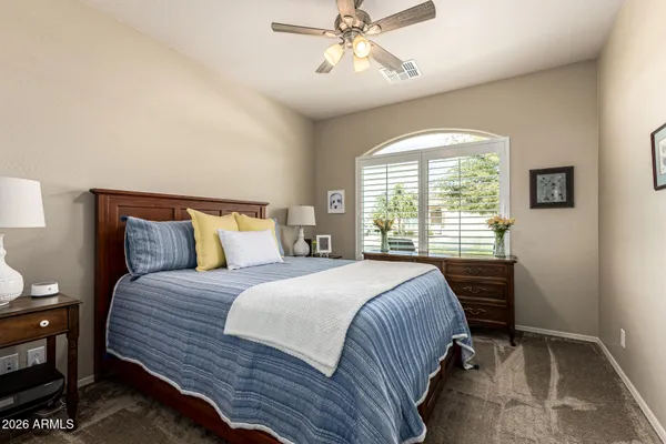 a bedroom with a bed and window