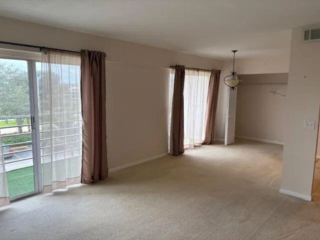 a view of empty room with windows