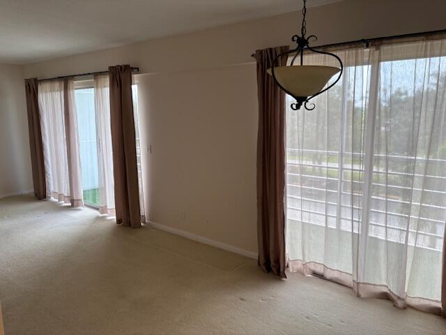 35 Mansfield A, Unit 35 Boca Raton, FL 33434 - Photo 8 of 17 a view of a room has a flat screen tv
