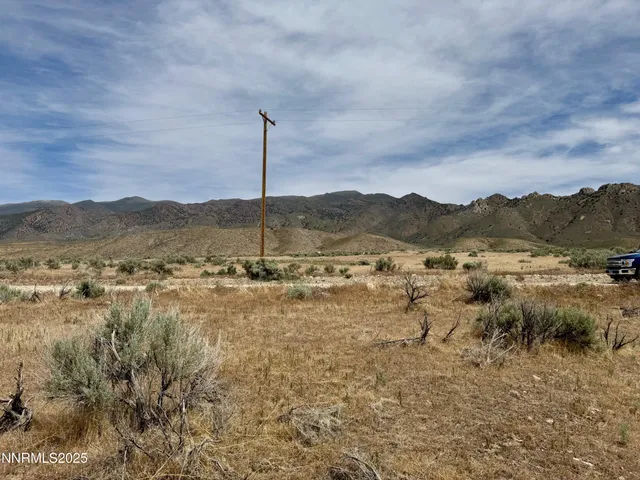 a view of a lake with mountains in the background
