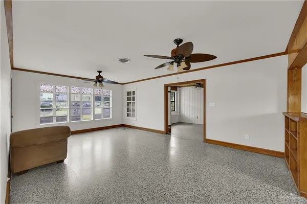 a view of room with window and wooden floor