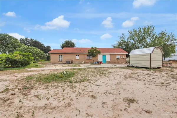 a house view with a backyard space