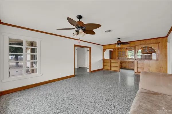 a view of an empty room with a window