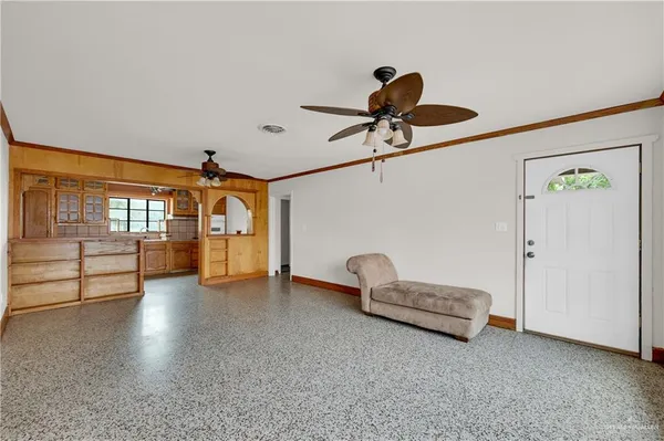 a view of a livingroom with furniture and hardwood floor