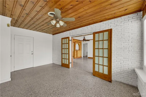 a view of an empty room with a window