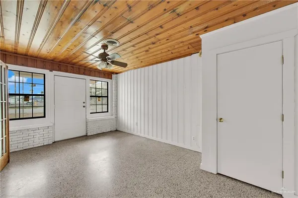 en empty room with windows