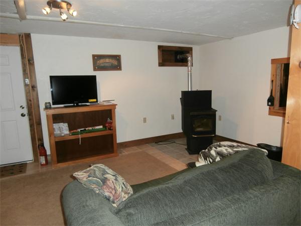 2279 Barre Road Hardwick, MA 01037 - Photo 14 of 25 a bedroom with a bed and flat screen tv