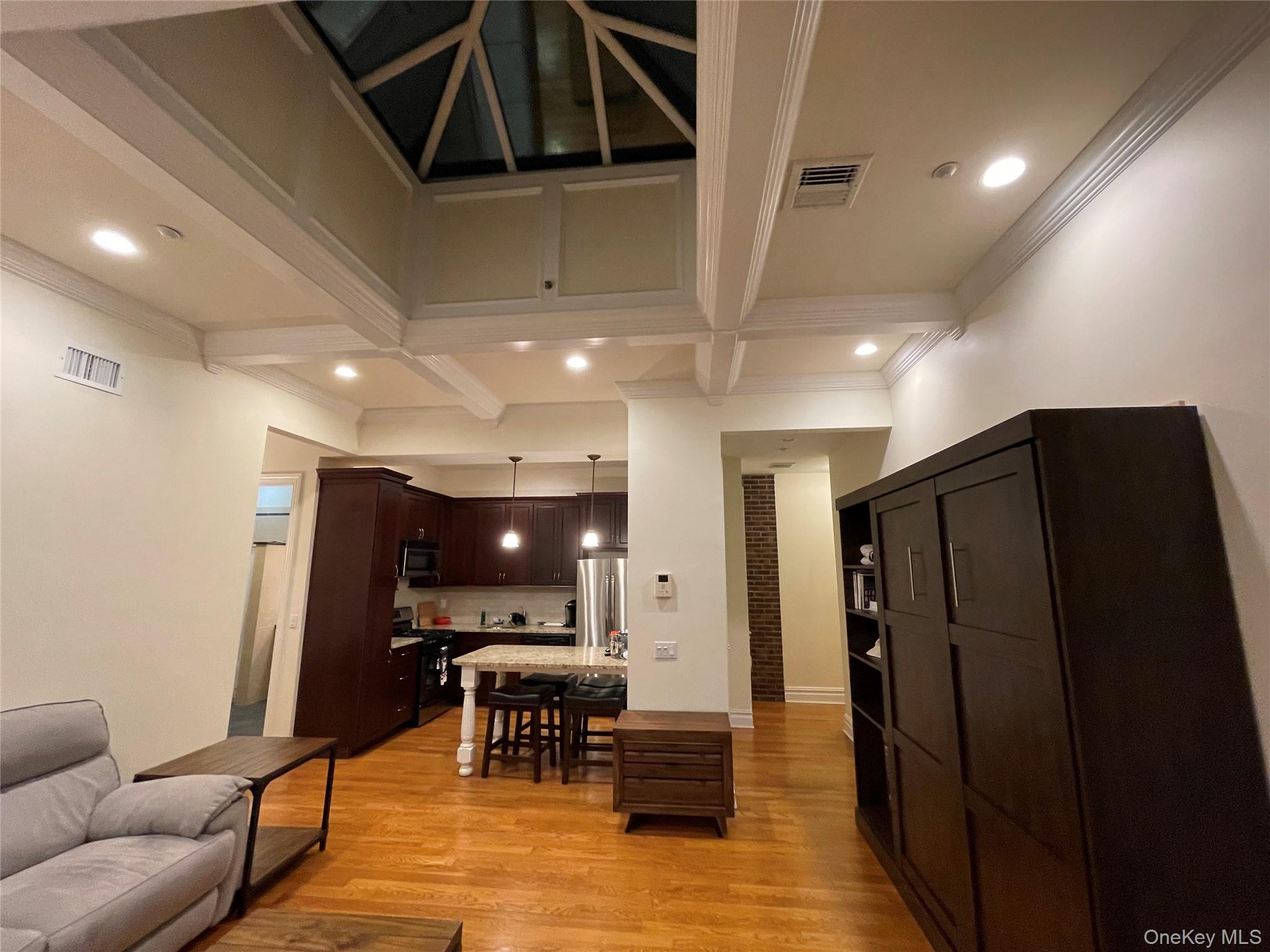377 New York Avenue, Unit C Huntington, NY 11743 - Photo 6 of 10 a view of a livingroom with furniture and a potted plant