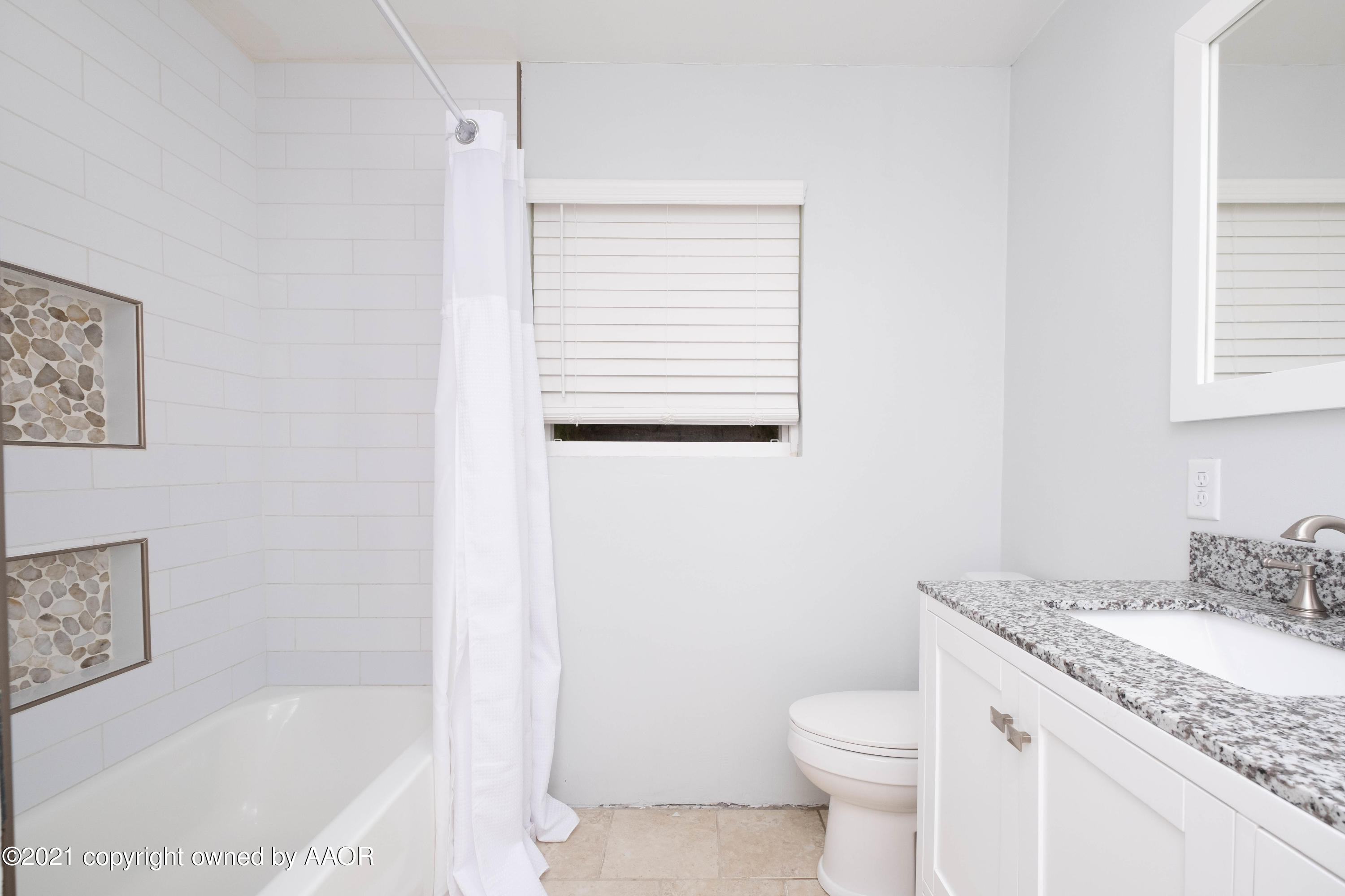 6213 Calumet Road Amarillo, TX 79106 - Photo 22 of 29 a bathroom with a granite countertop sink toilet and shower