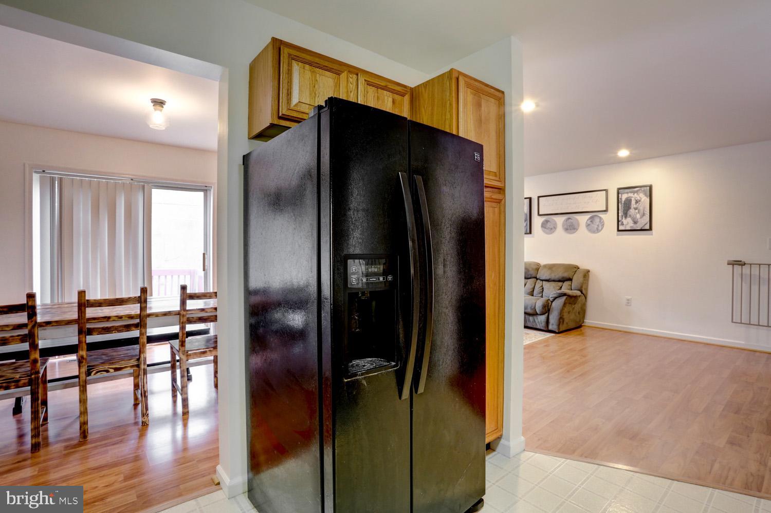 358 Crosswinds Drive Lititz, PA 17543 - Photo 16 of 39 a kitchen with stainless steel appliances a refrigerator and wooden floor