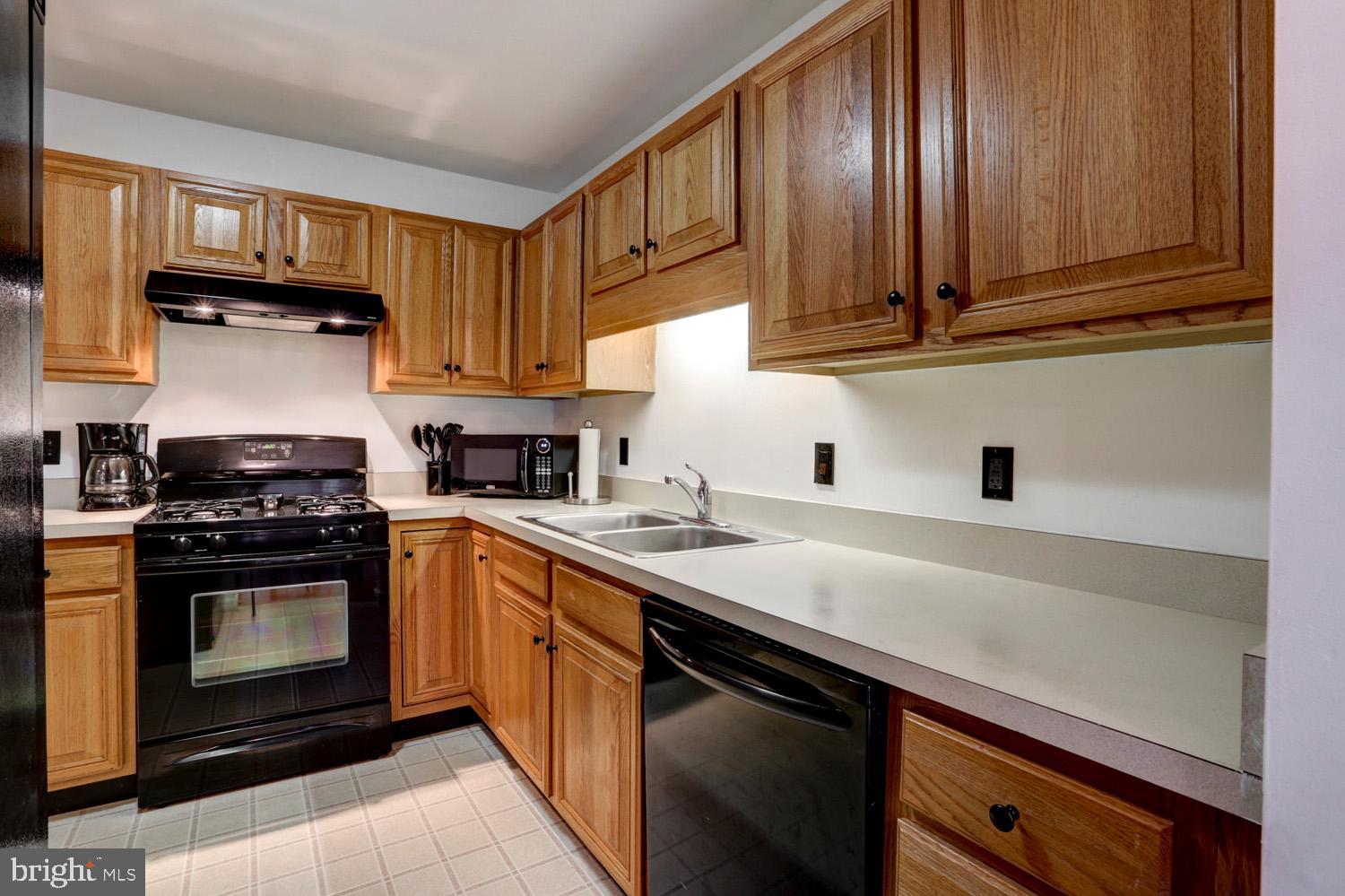 358 Crosswinds Drive Lititz, PA 17543 - Photo 17 of 39 a kitchen with stainless steel appliances granite countertop a sink stove and cabinets