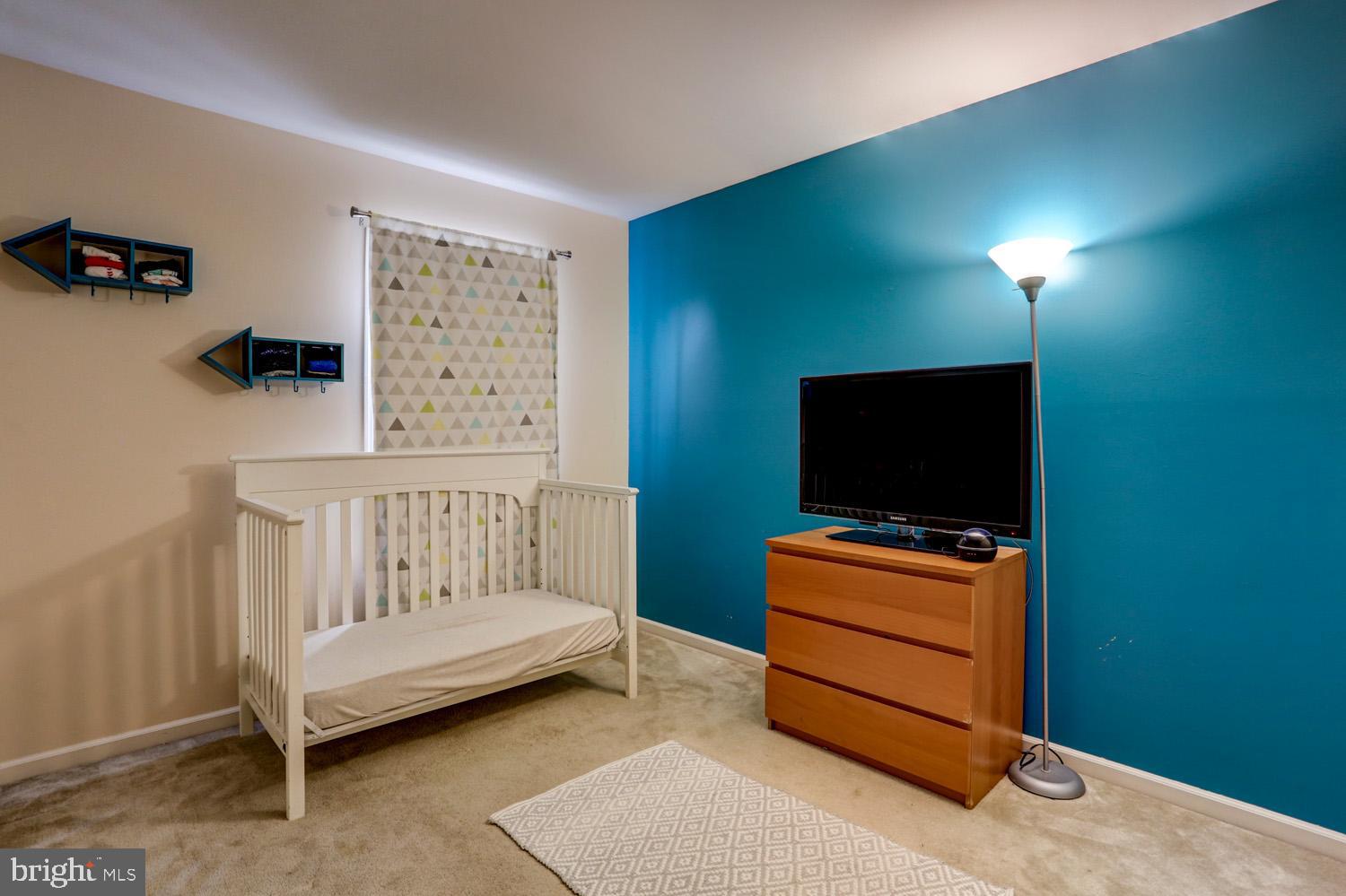 358 Crosswinds Drive Lititz, PA 17543 - Photo 26 of 39 a bedroom with furniture and a flat screen tv