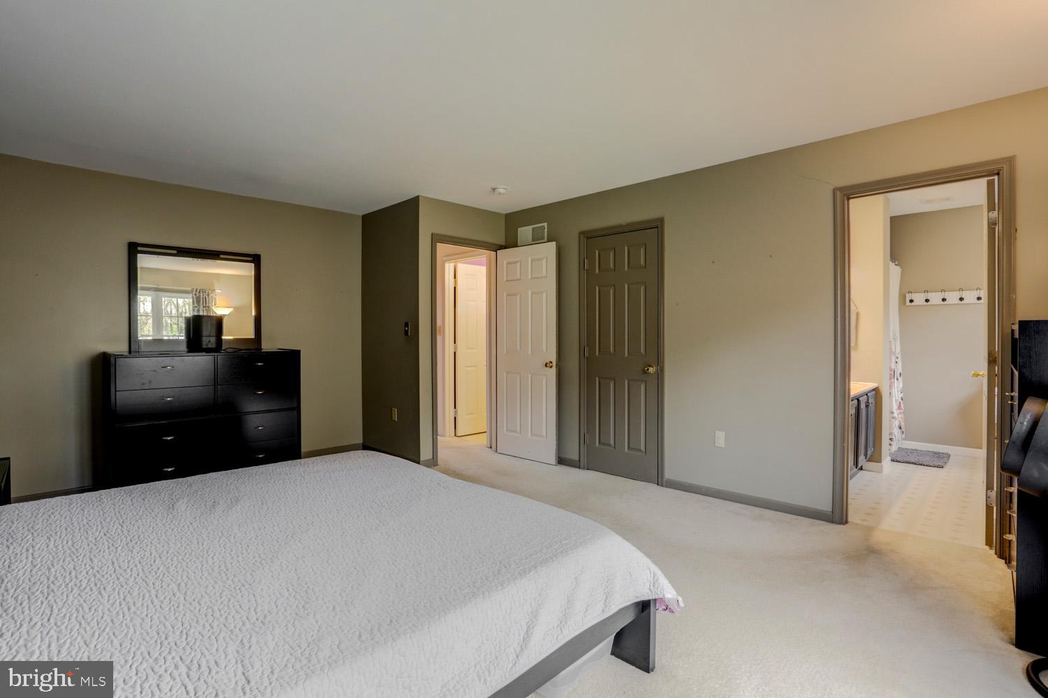 358 Crosswinds Drive Lititz, PA 17543 - Photo 31 of 39 a bedroom with a bed and a large mirror