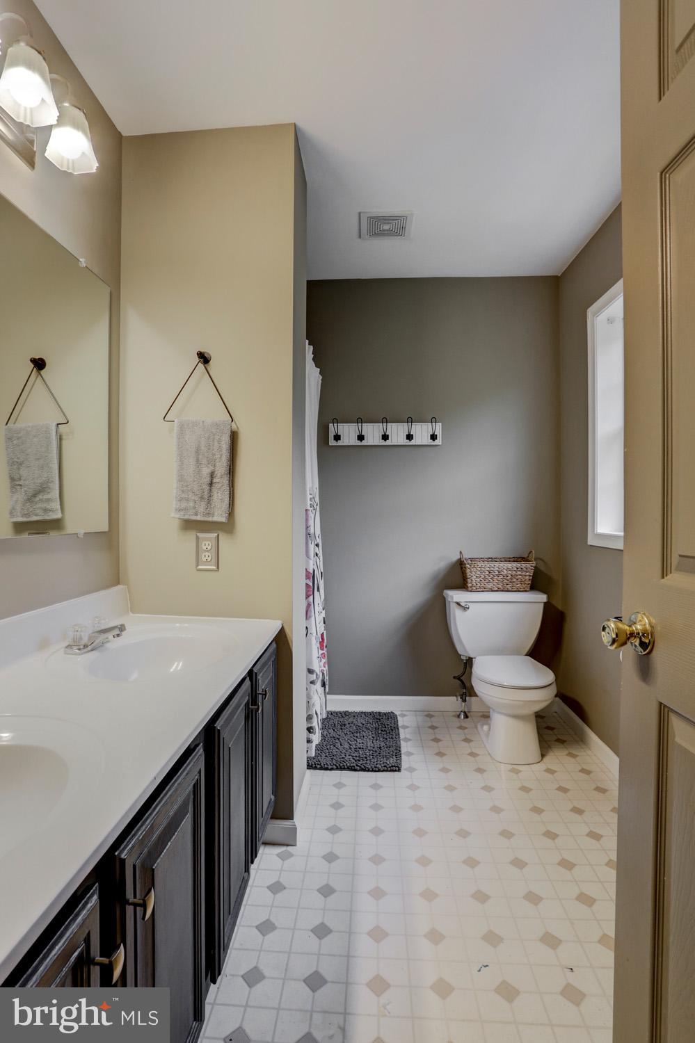 358 Crosswinds Drive Lititz, PA 17543 - Photo 34 of 39 a bathroom with a sink a toilet and a mirror