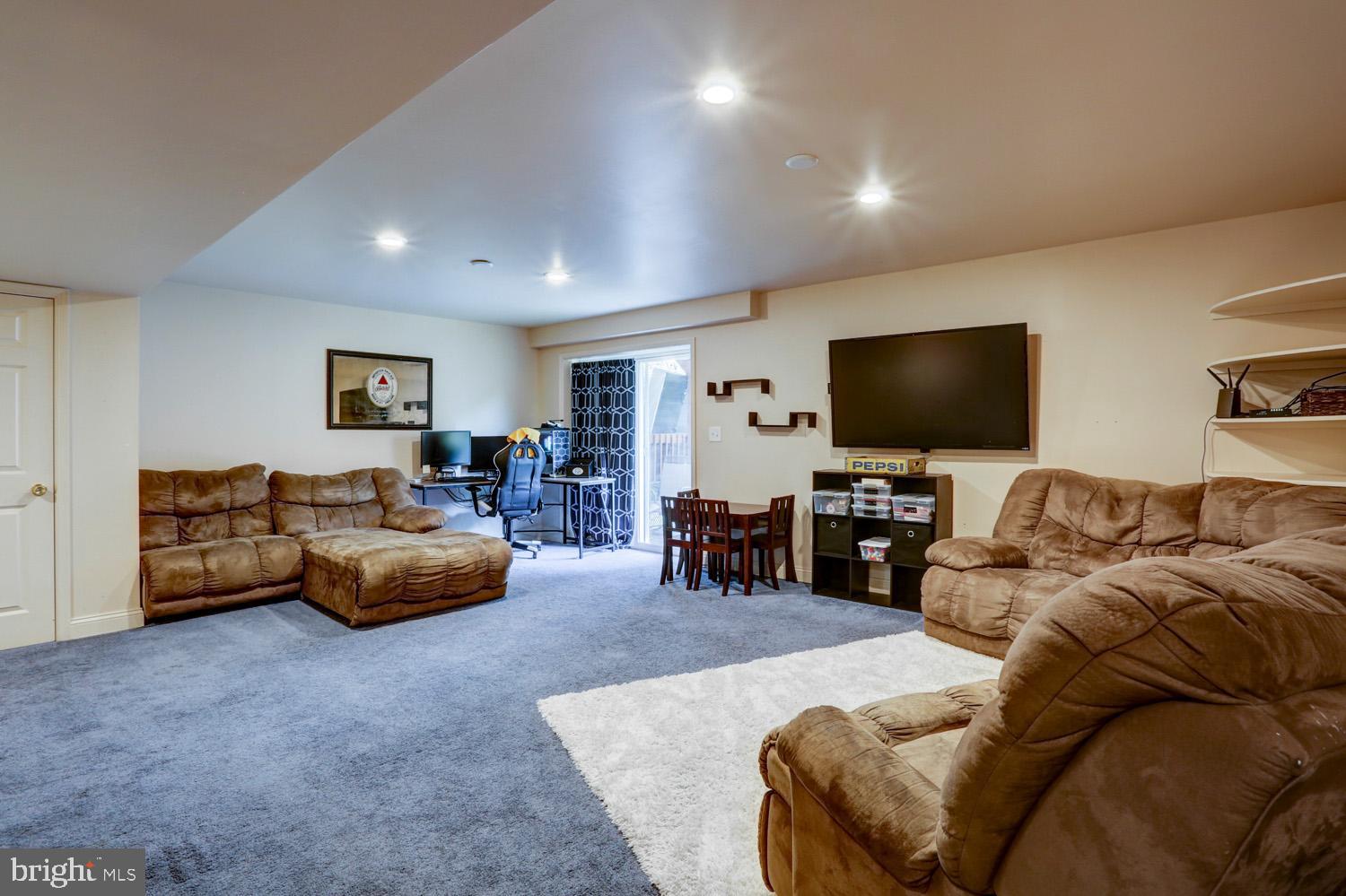 358 Crosswinds Drive Lititz, PA 17543 - Photo 35 of 39 a living room with furniture and a flat screen tv
