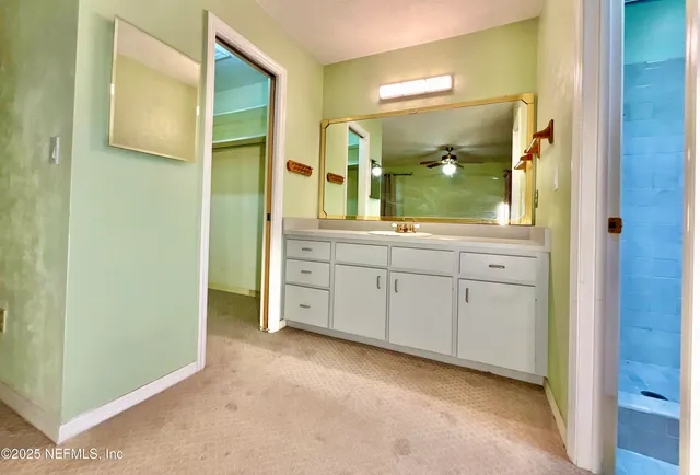 a bathroom with a double vanity sink and mirror