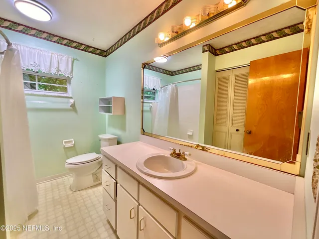 a living room with a table and a window