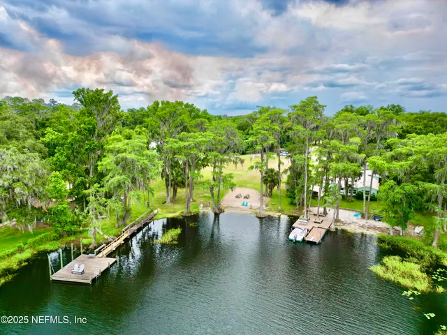 a view of a lake with a yard