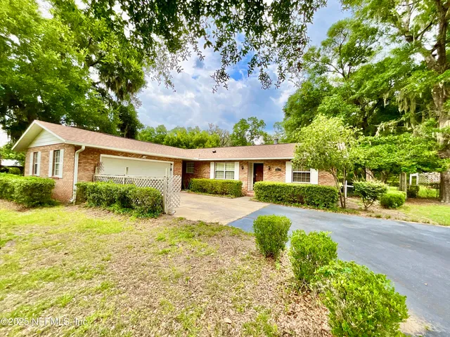 front view of a house with a big yard