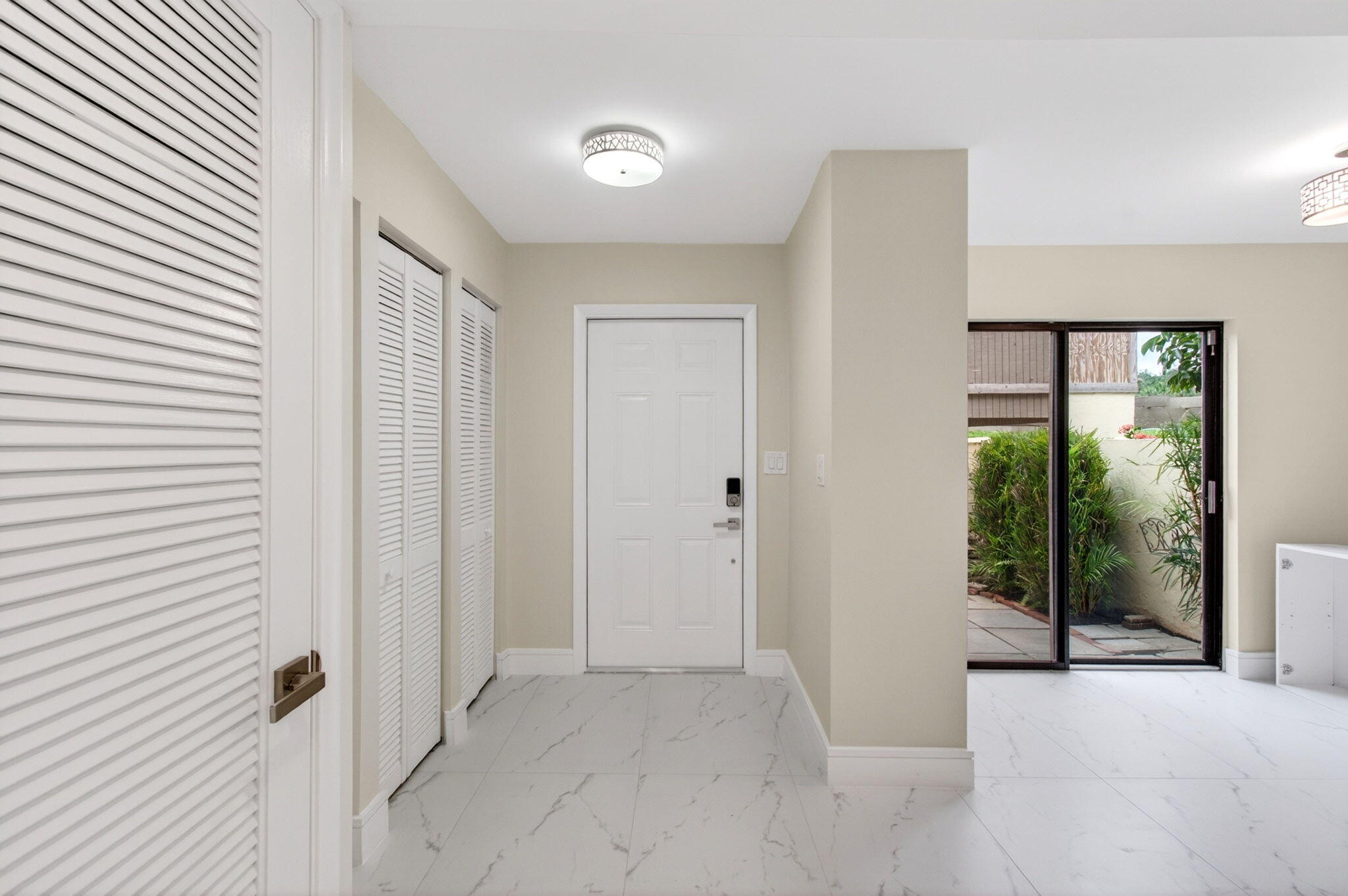 1330 Northwest 13th Street, Unit 12 Boca Raton, FL 33486 - Photo 18 of 52 a view of a room with a large window